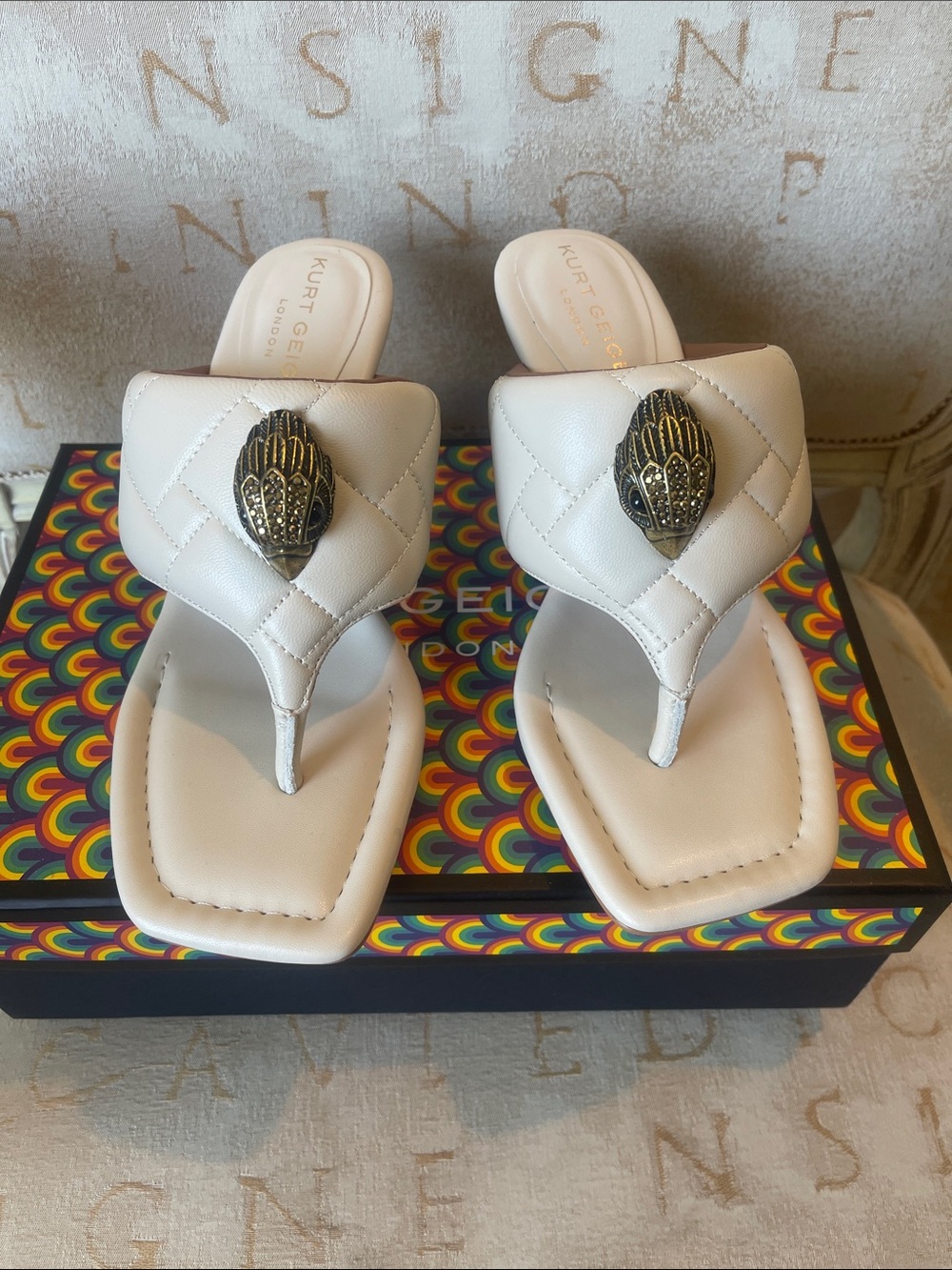 Kurt Geiger Bone Quilted Thong Sandals with Decorative Gold Medallion